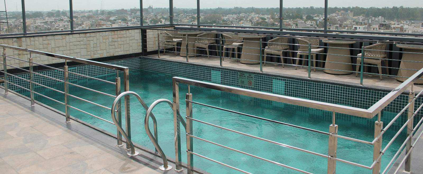 Rooftop swimming pool with city views at BluSalzz Residence, Amritsar.